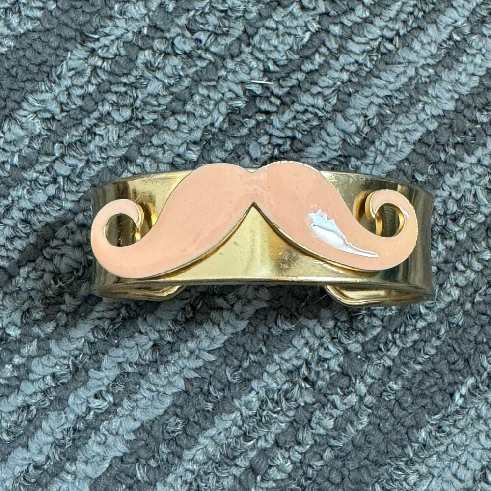 Gold tone peach/nude mustache metal cuff bracelet